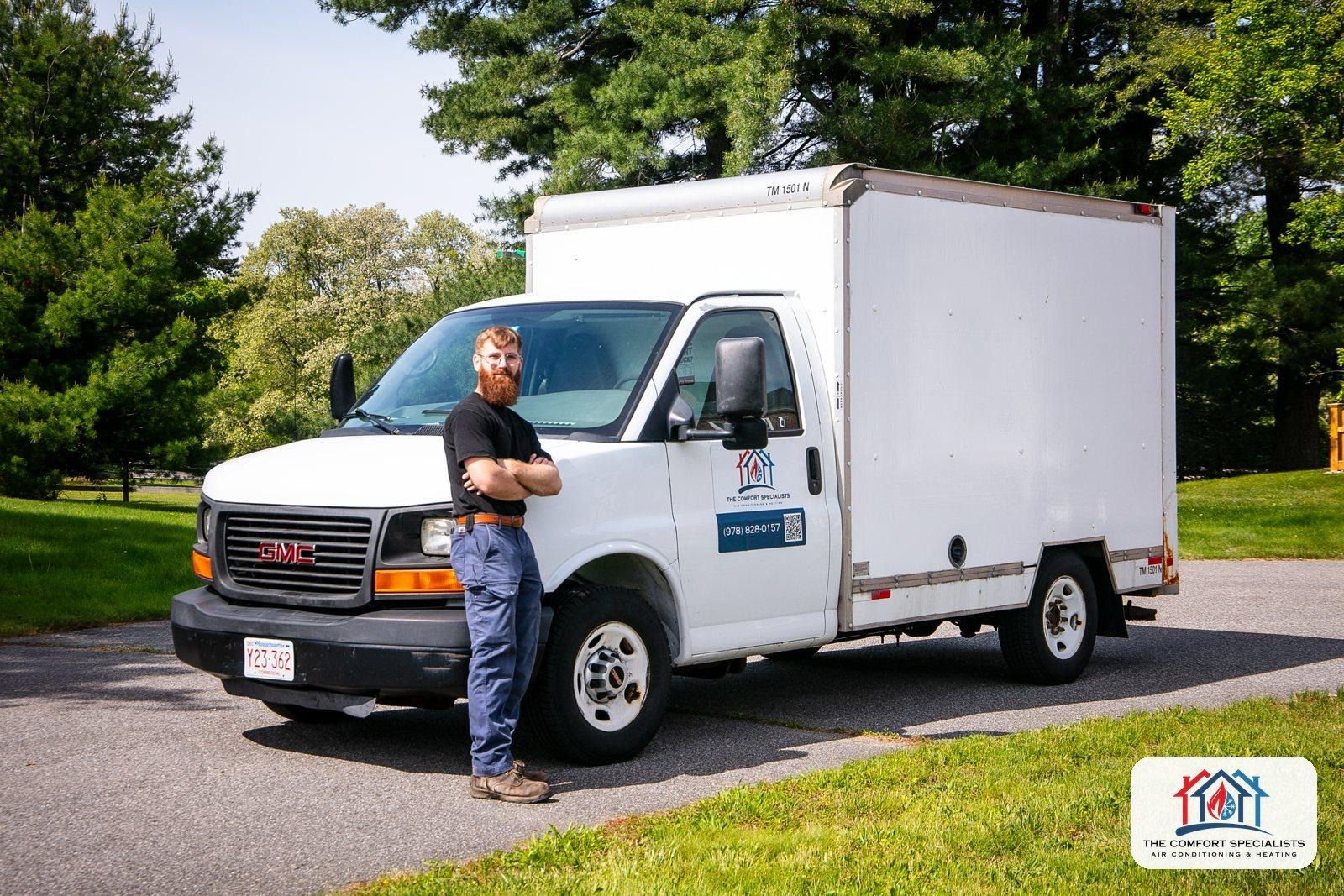 A Comfort Specialists technician next to the company service truck in Central Massachusetts A Comfort Specialists technician next to the company service truck in Central Massachusetts